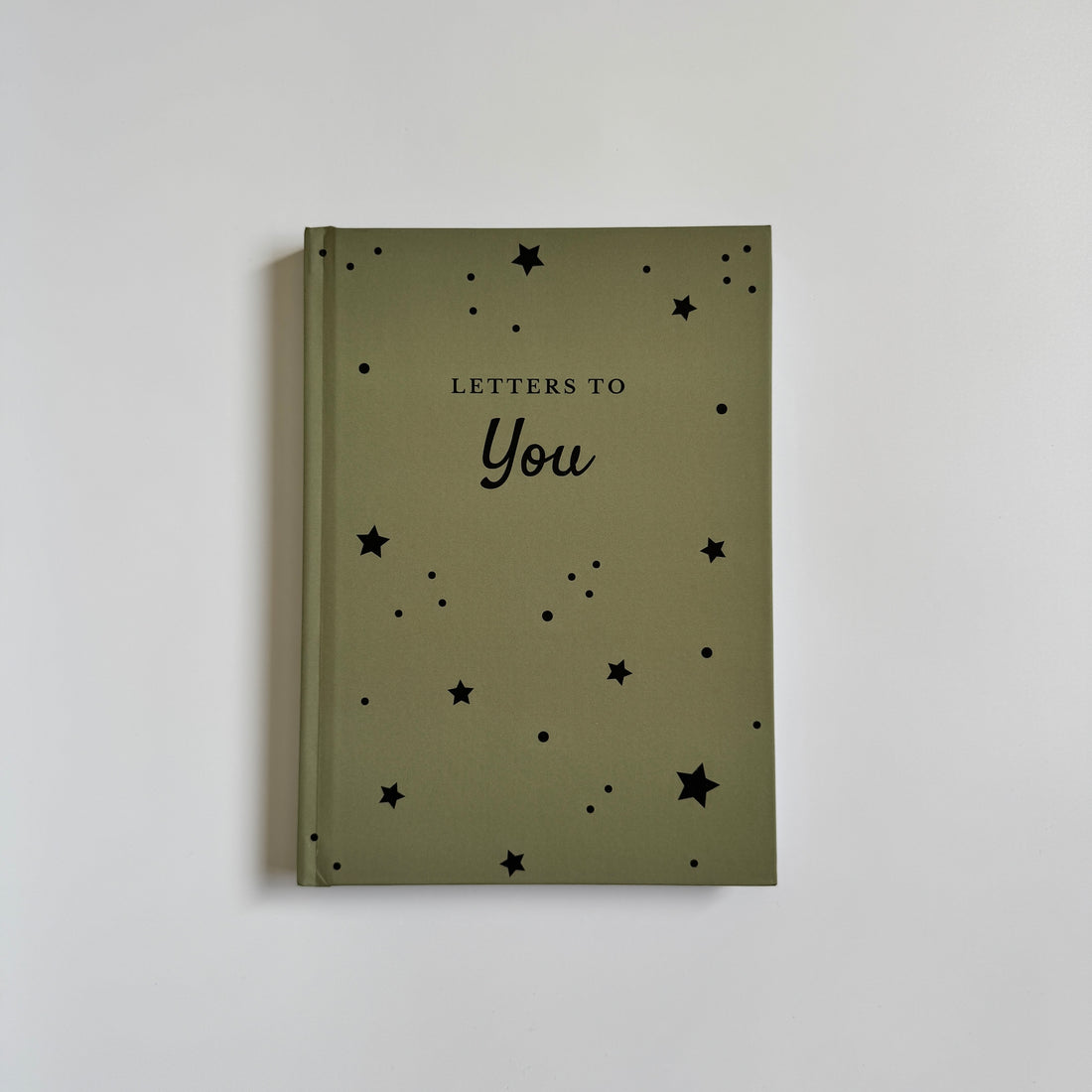 Green notebook with &