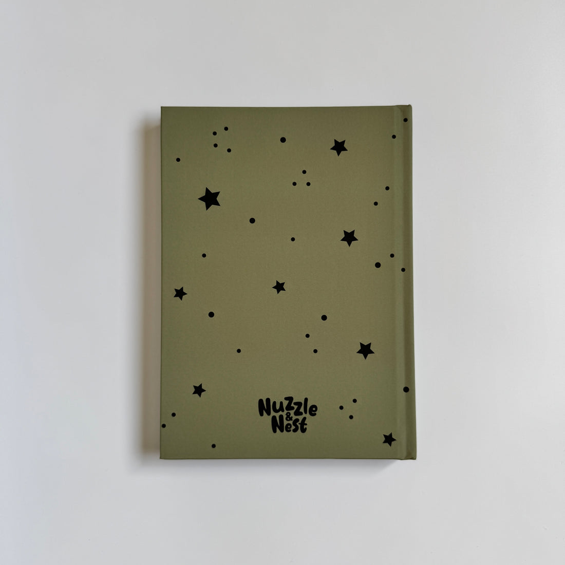 Green notebook with black star patterns and &