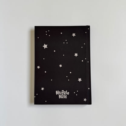 Black paper with white star patterns on a light gray background